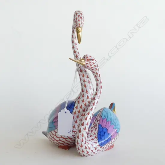 A Herend Porcelain pair of swans, in orange 'fishnet' pattern